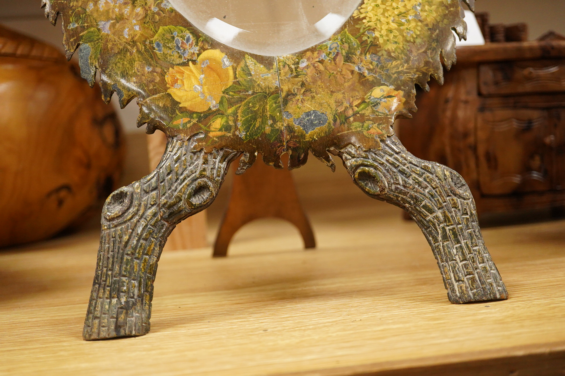 A framed botanical print, circular mirror, floral wood block and a set of 6 metal place mats